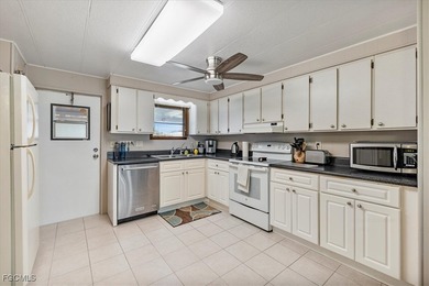 Welcome to this beautiful and spacious home in Tamiami Village on Six Lakes Country Club in Florida - for sale on GolfHomes.com, golf home, golf lot