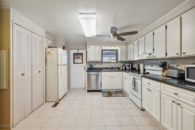 Welcome to this beautiful and spacious home in Tamiami Village on Six Lakes Country Club in Florida - for sale on GolfHomes.com, golf home, golf lot