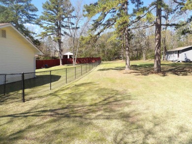LOCATED ACROSS STREET FROM GREERS FERRY LAKE AND CENTRALLY on Thunderbird Country Club in Arkansas - for sale on GolfHomes.com, golf home, golf lot