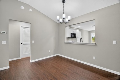 BEAUTIFULLY RENOVATED 3/2 WISTERIA MODEL with NEW ROOF (2025) on The Links of Spruce Creek in Florida - for sale on GolfHomes.com, golf home, golf lot