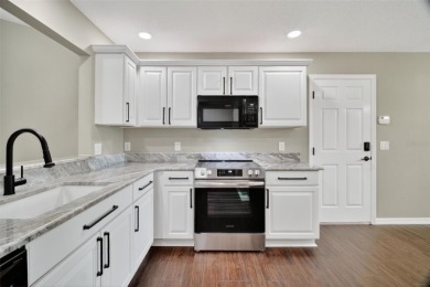 BEAUTIFULLY RENOVATED 3/2 WISTERIA MODEL with NEW ROOF (2025) on The Links of Spruce Creek in Florida - for sale on GolfHomes.com, golf home, golf lot