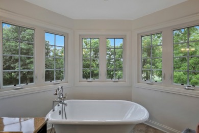 Custom home with 4 spacious bedrooms, 4.5 bathrooms nestled on on Blackstone Golf Club in Illinois - for sale on GolfHomes.com, golf home, golf lot