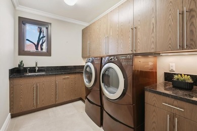 Experience luxury redefined in this custom 5-bedroom, 5 full & 3 on Heron Bay Golf Club in Florida - for sale on GolfHomes.com, golf home, golf lot