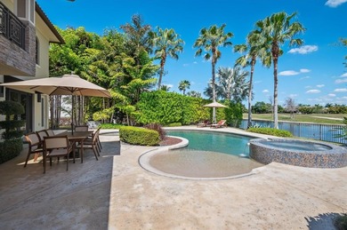 Experience luxury redefined in this custom 5-bedroom, 5 full & 3 on Heron Bay Golf Club in Florida - for sale on GolfHomes.com, golf home, golf lot
