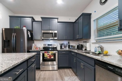 Set in a desirable golf course neighborhood, this stylish on St. Andrews Golf and Country Club in Georgia - for sale on GolfHomes.com, golf home, golf lot