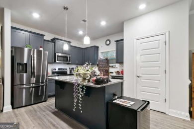 Set in a desirable golf course neighborhood, this stylish on St. Andrews Golf and Country Club in Georgia - for sale on GolfHomes.com, golf home, golf lot