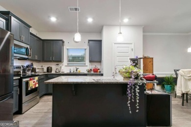 Set in a desirable golf course neighborhood, this stylish on St. Andrews Golf and Country Club in Georgia - for sale on GolfHomes.com, golf home, golf lot