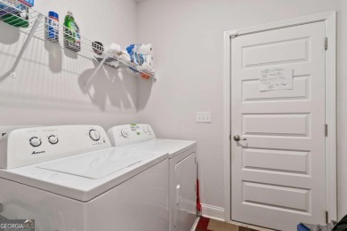 Set in a desirable golf course neighborhood, this stylish on St. Andrews Golf and Country Club in Georgia - for sale on GolfHomes.com, golf home, golf lot
