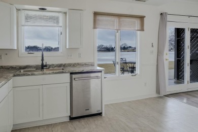 Welcome to this beautifully remodeled lakefront condo located on on Lakes of the Four Seasons Country Club in Indiana - for sale on GolfHomes.com, golf home, golf lot