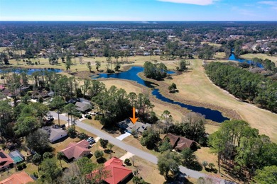 Perfectly positioned in the heart of Palm Coast, yet a world on The Grand Club - Pine Lakes Course in Florida - for sale on GolfHomes.com, golf home, golf lot