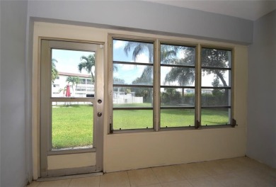 Rarely available, *investor friendly*, light & bright 2 bedroom on Crystal Lake Country Club in Florida - for sale on GolfHomes.com, golf home, golf lot