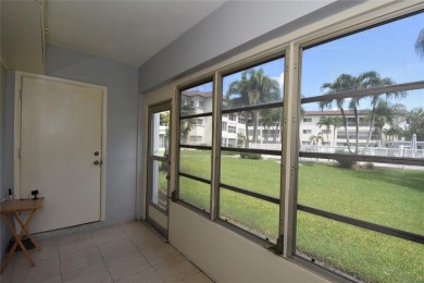 Rarely available, *investor friendly*, light & bright 2 bedroom on Crystal Lake Country Club in Florida - for sale on GolfHomes.com, golf home, golf lot