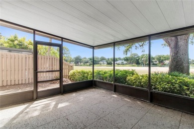 Welcome to your dream townhome that overlooks the 17th green of on Feather Sound Country Club in Florida - for sale on GolfHomes.com, golf home, golf lot