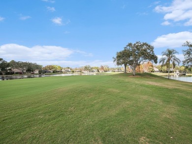 Welcome to your dream townhome that overlooks the 17th green of on Feather Sound Country Club in Florida - for sale on GolfHomes.com, golf home, golf lot