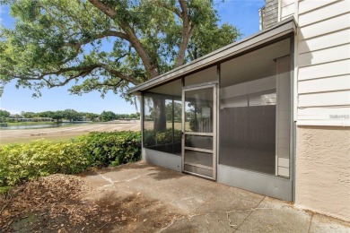 Welcome to your dream townhome that overlooks the 17th green of on Feather Sound Country Club in Florida - for sale on GolfHomes.com, golf home, golf lot