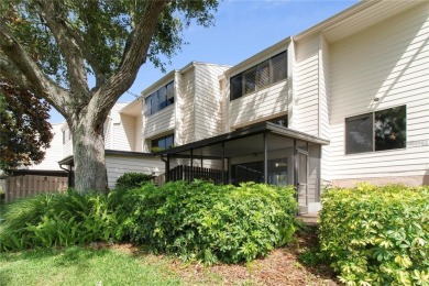 Welcome to your dream townhome that overlooks the 17th green of on Feather Sound Country Club in Florida - for sale on GolfHomes.com, golf home, golf lot