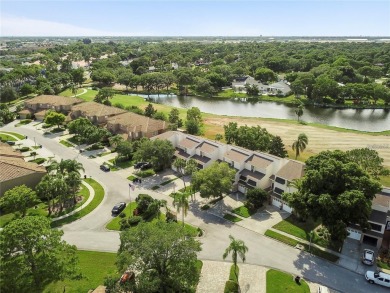 Welcome to your dream townhome that overlooks the 17th green of on Feather Sound Country Club in Florida - for sale on GolfHomes.com, golf home, golf lot