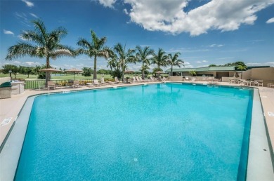 Welcome to your dream townhome that overlooks the 17th green of on Feather Sound Country Club in Florida - for sale on GolfHomes.com, golf home, golf lot