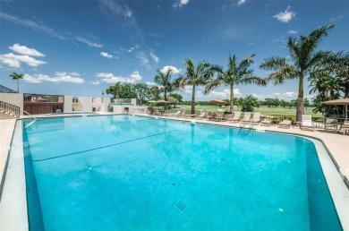 Welcome to your dream townhome that overlooks the 17th green of on Feather Sound Country Club in Florida - for sale on GolfHomes.com, golf home, golf lot