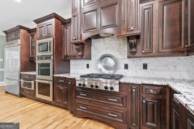 EXQUISITE LUXURY LIVING IN ST MARLO COUNTRY CLUB! This all-brick on St. Marlo Country Club in Georgia - for sale on GolfHomes.com, golf home, golf lot