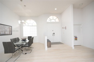 Discover this stunning one-story estate in Weston Hills on Weston Hills Country Club in Florida - for sale on GolfHomes.com, golf home, golf lot