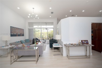 Discover this stunning one-story estate in Weston Hills on Weston Hills Country Club in Florida - for sale on GolfHomes.com, golf home, golf lot