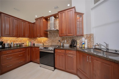 Discover this stunning one-story estate in Weston Hills on Weston Hills Country Club in Florida - for sale on GolfHomes.com, golf home, golf lot