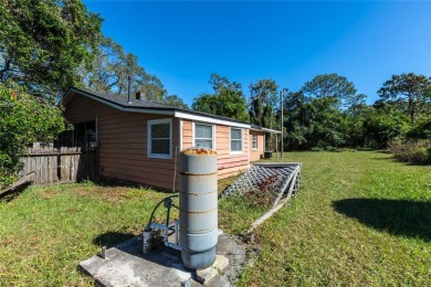 Under contract-accepting backup offers. Charming Home in on River Hills Country Club in Florida - for sale on GolfHomes.com, golf home, golf lot