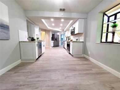 ** TOTAL REMODEL 2024!** Enjoy maintenance-free living with a on Tarpon Woods Golf Club in Florida - for sale on GolfHomes.com, golf home, golf lot