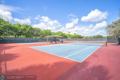 Experience modern elegance in this beautifully updated 2-bedroom on Palm-Aire Country Club and Resort - The Oaks in Florida - for sale on GolfHomes.com, golf home, golf lot