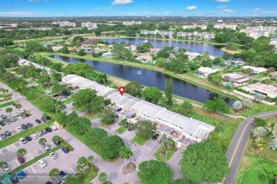 Experience modern elegance in this beautifully updated 2-bedroom on Palm-Aire Country Club and Resort - The Oaks in Florida - for sale on GolfHomes.com, golf home, golf lot