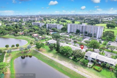 Experience modern elegance in this beautifully updated 2-bedroom on Palm-Aire Country Club and Resort - The Oaks in Florida - for sale on GolfHomes.com, golf home, golf lot