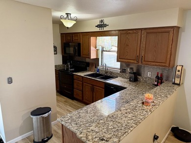 Welcome to this beautifully updated, fully furnished condo on Pointe Royale Village Country Club in Missouri - for sale on GolfHomes.com, golf home, golf lot