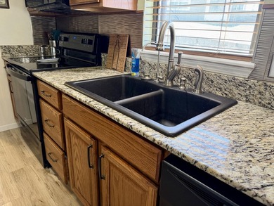 Welcome to this beautifully updated, fully furnished condo on Pointe Royale Village Country Club in Missouri - for sale on GolfHomes.com, golf home, golf lot