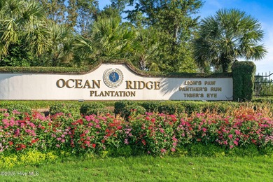 Expansive open views of Lions Paw #13 fairway and pond from this on Ocean Ridge Plantation in North Carolina - for sale on GolfHomes.com, golf home, golf lot