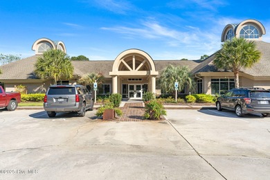 Expansive open views of Lions Paw #13 fairway and pond from this on Ocean Ridge Plantation in North Carolina - for sale on GolfHomes.com, golf home, golf lot