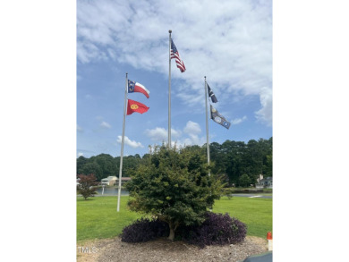 This prime location in peaceful Mallard Cove is just steps from on Carolina Trace Country Club in North Carolina - for sale on GolfHomes.com, golf home, golf lot