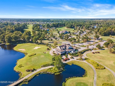 Expansive open views of Lions Paw #13 fairway and pond from this on Ocean Ridge Plantation in North Carolina - for sale on GolfHomes.com, golf home, golf lot