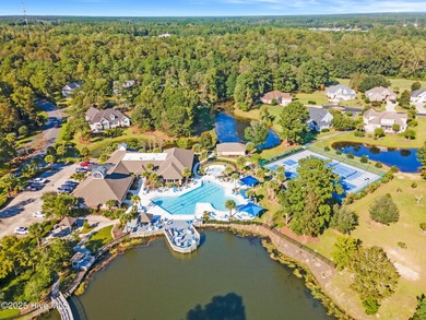 Expansive open views of Lions Paw #13 fairway and pond from this on Ocean Ridge Plantation in North Carolina - for sale on GolfHomes.com, golf home, golf lot