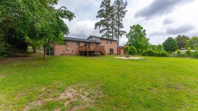 Welcome Home! This 4-bedroom, 2-bathroom residence boasts an on Lakewood Golf Course in Alabama - for sale on GolfHomes.com, golf home, golf lot