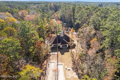 Expansive open views of Lions Paw #13 fairway and pond from this on Ocean Ridge Plantation in North Carolina - for sale on GolfHomes.com, golf home, golf lot