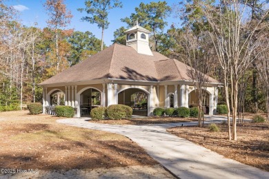 Expansive open views of Lions Paw #13 fairway and pond from this on Ocean Ridge Plantation in North Carolina - for sale on GolfHomes.com, golf home, golf lot