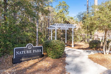 Expansive open views of Lions Paw #13 fairway and pond from this on Ocean Ridge Plantation in North Carolina - for sale on GolfHomes.com, golf home, golf lot