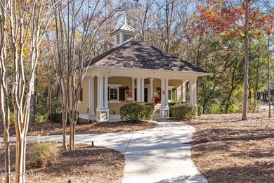 Expansive open views of Lions Paw #13 fairway and pond from this on Ocean Ridge Plantation in North Carolina - for sale on GolfHomes.com, golf home, golf lot