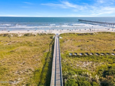 Expansive open views of Lions Paw #13 fairway and pond from this on Ocean Ridge Plantation in North Carolina - for sale on GolfHomes.com, golf home, golf lot