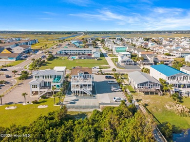 Expansive open views of Lions Paw #13 fairway and pond from this on Ocean Ridge Plantation in North Carolina - for sale on GolfHomes.com, golf home, golf lot