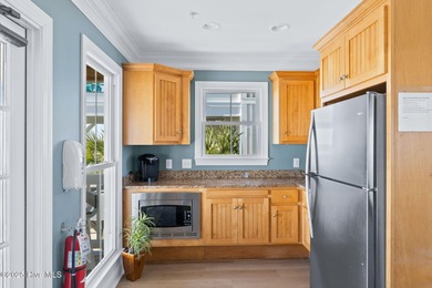 Expansive open views of Lions Paw #13 fairway and pond from this on Ocean Ridge Plantation in North Carolina - for sale on GolfHomes.com, golf home, golf lot