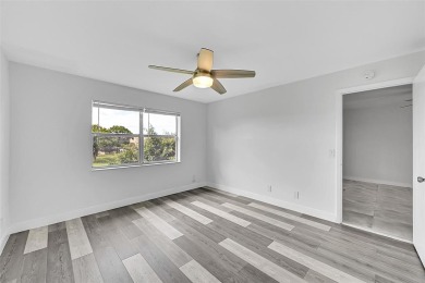 55+ COMMUNITY, THIS TURN KEY READY CORNER UNIT IS ON THE 3Rd on Sunrise Lakes Phase III in Florida - for sale on GolfHomes.com, golf home, golf lot