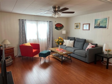 A charming mobile home nestled in a vibrant 55+ community is a on Palm Hill Golf Club in Florida - for sale on GolfHomes.com, golf home, golf lot