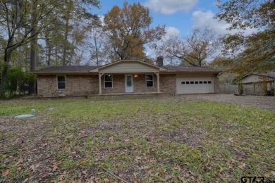 This lovely single-story home combines comfort, style, and on Hide-A-Way Lake Golf Course in Texas - for sale on GolfHomes.com, golf home, golf lot